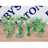 A LOT OF ANTIQUE AND LATER GREEN WINE AND DRINKING GLASSES SOME WITH HEAVY CUT STEMS