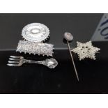 A STERLING SILVER BROOCH IN THE FORM OF A FORK A MEXICAN STAR SHAPED WHITE METAL ONES ETC