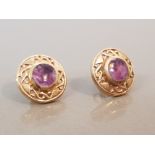 18CT GOLD PURPLE STONE STUDS