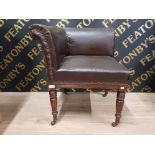 A VICTORIAN CORNER CHAIR UPHOLSTERED IN LEATHER EFFECT CANVAS RAISED ON TURNED MAHOGANY LEGS