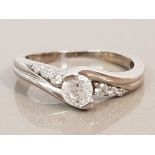 9CT WHITE GOLD DIAMOND SOLITAIRE RING WITH DIAMOND ON SHOULDER
