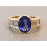 18CT GOLD BLUE OVAL STONE AND BAGUETTE DIAMOND RING 10.2G SIZE P1/2