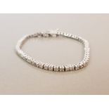 BEAUTIFUL 14CT WHITE GOLD DIAMOND TENNIS BRACELET APPROXIMATELY 3CTS WITH SAFETY CHAIN 8G 17CMS