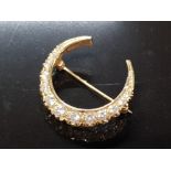 9CT GOLD AND CZ CRESCENT SHAPED BROOCH