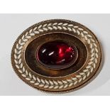 VICTORIAN GILT METAL AND ENAMELLED BROOCH WITH HUGE RED CENTRE STONE