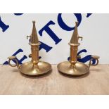 A PAIR OF VINTAGE BRASS CHAMBER STICKS WITH SNUFFERS