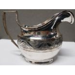 A GEORGIAN SILVER CREAM JUG WITH BRIGHT CUT ENGRAVING MAKER'S MARK SB 117.4G