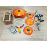 LE CREUSET CAST IRON CASSEROLE DISH AND OTHERS TOGETHER WITH A VERSATILE SLICER AND GRATER AND A
