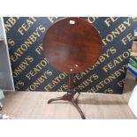 A 19TH CENTURY TIP UP TOP TRIPOD TABLE 54CM DIAMETER