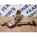 A DOME CLOCK TOGETHER WITH A REPRODUCTION BAROMETER WITH BRASS DIAL