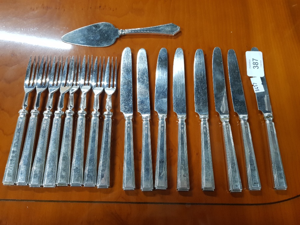 A SET OF SIX SILVER HANDLED CAKE KNIVES AND FORKS WITH SMALL SILVER HANDLED CAKE SLICE BY THOMAS