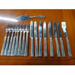 A SET OF SIX SILVER HANDLED CAKE KNIVES AND FORKS WITH SMALL SILVER HANDLED CAKE SLICE BY THOMAS