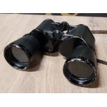 A PAIR OF WWII GERMAN 10 X 50 BINOCULARS MARKED DIENSTGLAS WITH TOTENKOMF STAMP TO TOP RIGHT