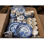 A BOX CONTAINING A LARGE QUANTITY OF BLUE AND WHITE POTTERY INCLUDES OLD WILLOW CHURCHILL ETC