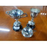 THREE SILVER TROPHIES ONE MARKED FOR UGC SMITH CUP AND THE OTHER TWO TWIN HANDLED UNDEDICATED AND ON