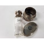 SILVER TOPPED CUT GLASS BOTTLE JAR A SILVER NAPKIN RING AND A LID BY ASPREY OF BOND STREET