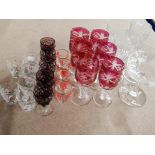 LOT OF 4 CRYSTAL CUT WINE GLASSES AND 6 FLASHED RED CUT WINE GLASSES PLUS VARIOUS SHOT GLASSES WHICH