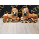 A PAIR OF STAFFORDSHIRE LION ORNAMENTS 31CM