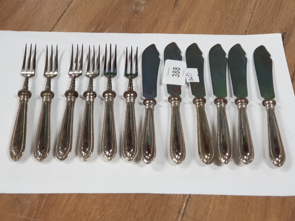 A SET OF SIX WHITE METAL HANDLED FISH KNIVES AND FORKS MARKED 800
