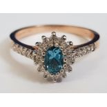 9CT ROSE GOLD CUBIC ZIRCONIA AND BLUE STONE RING, 2.5G SIZE P
