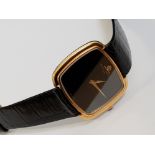 18CT YELLOW GOLD BAUME AND MERCIER WRISTWATCH WITH BLACK LEATHER STRAP AND DIAL