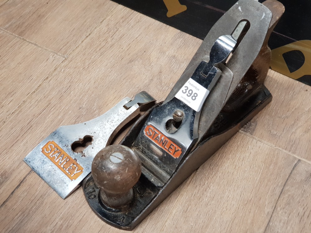 A STANLEY WOODWORKING PLANE, NO 4 TOGETHER WITH A LARGER GUARD