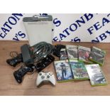 A WHITE XBOX 360 TOGETHER WITH FOUR CONTROLLERS AND 7 GAMES INCLUDING CALL OF DUTY WORLD AT WAR NEED