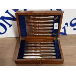 A SMALL OAK LOCKING CANTEEN WITH A SET OF HEAVY STERLING PLATE 6 PLACE CAKE KNIVES AND FORKS
