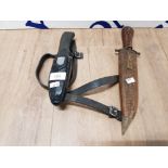 A SCUBA DAGGER NO 107954 AND ANOTHER WITH CARVED WOODEN GRIP AND SHEATH
