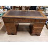 AN OAK TWIN PEDESTAL DESK WITH DARK BROWN LEATHER TOP 121CM WIDE