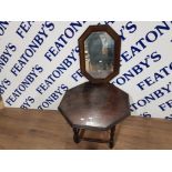 A LOW OAK OCTAGONAL OCCASIONAL TABLE 54CM DIAMETER TOGETHER WITH A WALL MIRROR