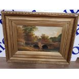 A 19TH/EARLY 20TH CENTURY OIL PAINTING FIGURE ON A BRIDGE INDISTINCTLY SIGNED 22.5 X 35.5CM