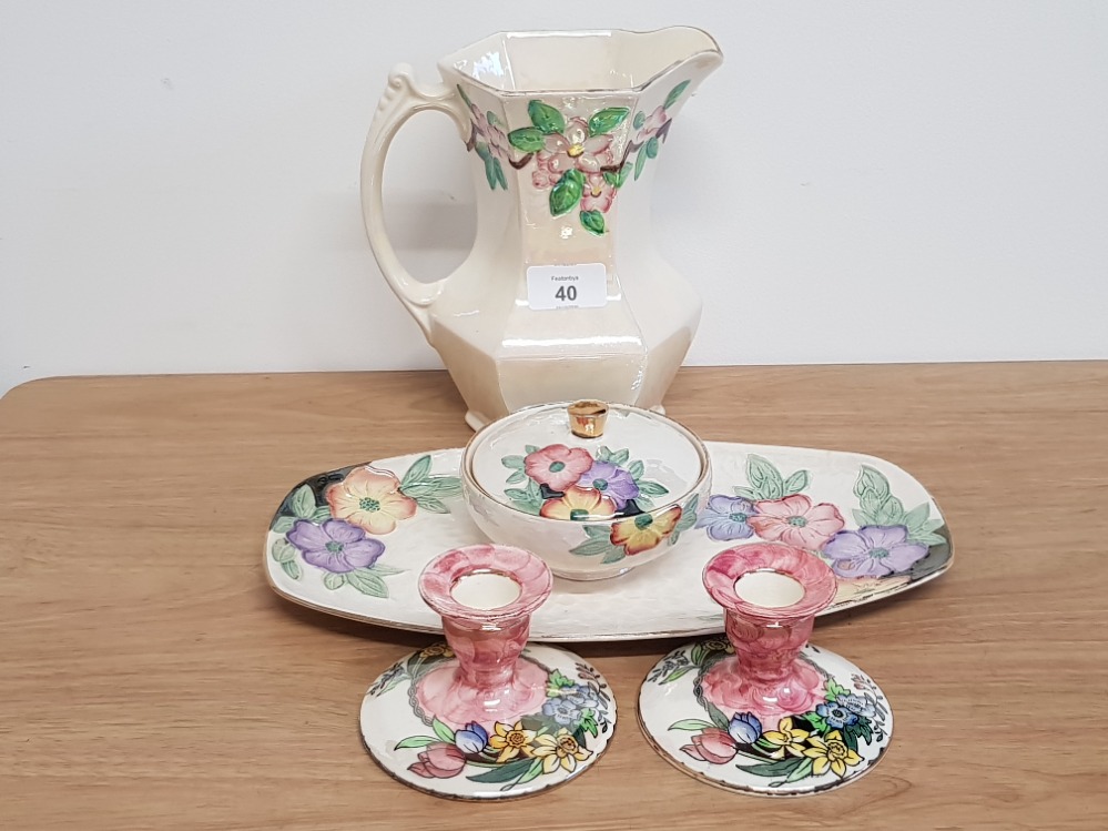 A PAIR OF PINK MALING CANDLESTICKS AND THREE PIECES OF MALING LUSTER INCLUDES LARGE JUG, LIDDED BOWL