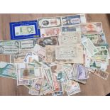 A TOTAL OF 242 BANKNOTES FROM AROUND THE WORLD IN MIXED CIRCULATION GRADES