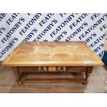 A WOODEN COUNTRY FORM RECTANGULAR COFFEE TABLE WITH DRAWER TO FRONT AND BACK TURNED LEGS