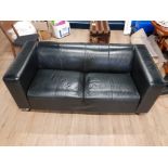 A BLACK LEATHERETTE 2 SEATER SETTEE