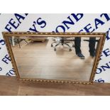 A MODERN BEVELLED WALL MIRROR IN GOLD COLOURED FRAME 60 X 90.5CM