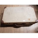A CANVAS AND LEATHER BOUND VINTAGE SUITCASE WITH MILITARY ARROW MARK TO INTERIOR 72CM