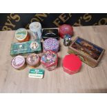 A COLECTION OF VINTAGE TINS. 13