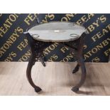 AN ANTIQUE SHAPED CIRCULAR TRAY 50.5CM DIAMETER WITH FOLDING WOODEN STAND 68CM HIGH