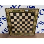 A WOOD AND LAMINATE CHESSBOARD