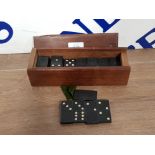 A BOX OF VINTAGE DOMINOS BY GEEVUM GAMES