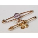 TWO ANTIQUE YELLOW METAL BROOCHES ONE WITH PURPLE STONE AND PEARL THE OTHER FOUR LEAF CLOVER 2.4G