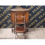 A 20TH CENTURY OAK CORNER CUPBOARD 58 X 74 X 39 CM AND A CHILDS FOLDING CHAIR WITH PIERCED SEAT