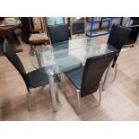 A CONTEMPORY GLASS TOPPED EXTENDING DINING TABLE AND 4 BLACK LEATHERETTE CHAIRS