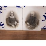 A PAIR OF VICTORIAN TRANSFER PRINTED PHOTOGRAPHS OF AN ELDERLY COUPLE ON GLASS WITH HAND PAINTED