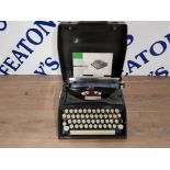 A VINTAGE PORTABLE TYPEWRITER BY TIPPA