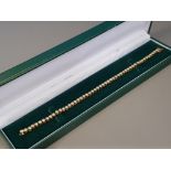 BOXED 2.5CT DIAMOND TENNIS BRACELET SET IN 18CT YELLOW GOLD