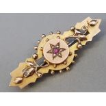 ANTIQUE VICTORIAN 9CT GOLD AND RUBY BROOCH, 3.8G