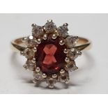 9CT YELLOW GOLD RED STONE AND DIAMOND CLUSTER RING, HALLMARKS RUBBED 3.1G SIZE P1/2